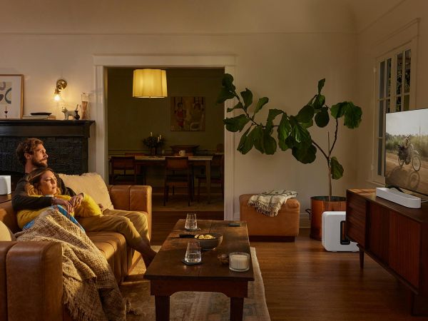 Cozy living room with warm lighting and a Sonos soundbar setup for home entertainment