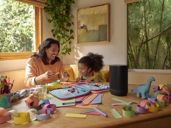 Child playing in a colorful room with a Sonos speaker providing background music