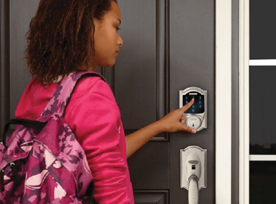 woman opening door using keypad from smart lock